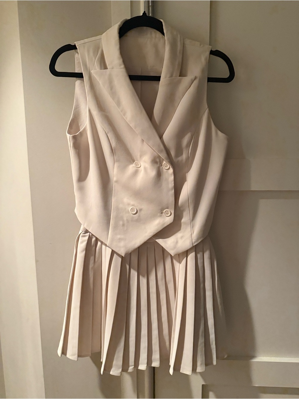 Sleeveless Double-Breasted Ivory Vest and Pleated mini skirt